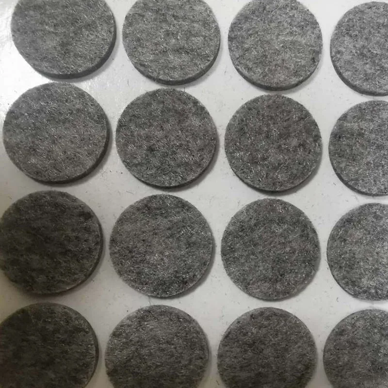 Adhesive-backed felt pad on liner